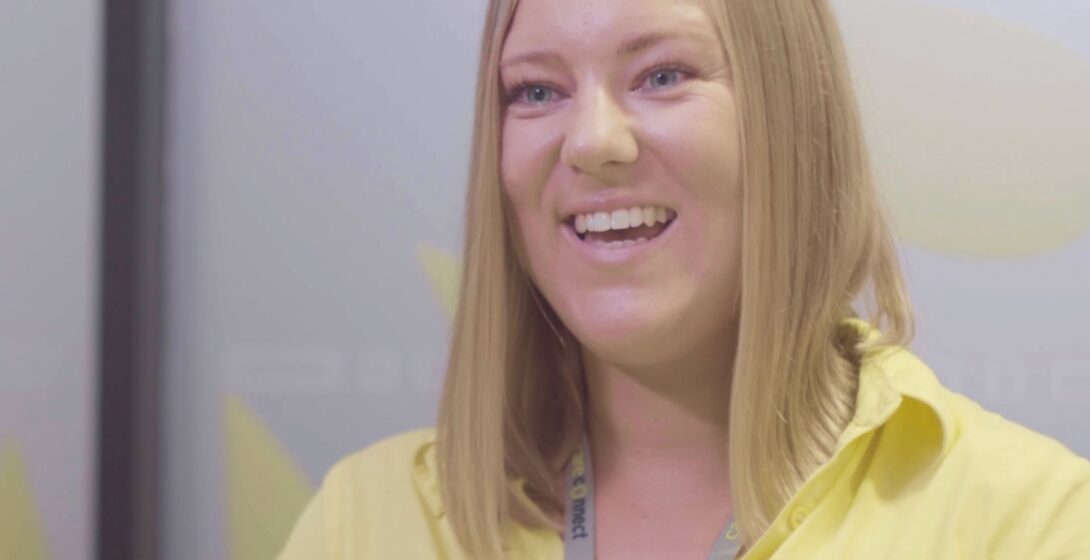 Care Connect staff member smiling while being interviewed